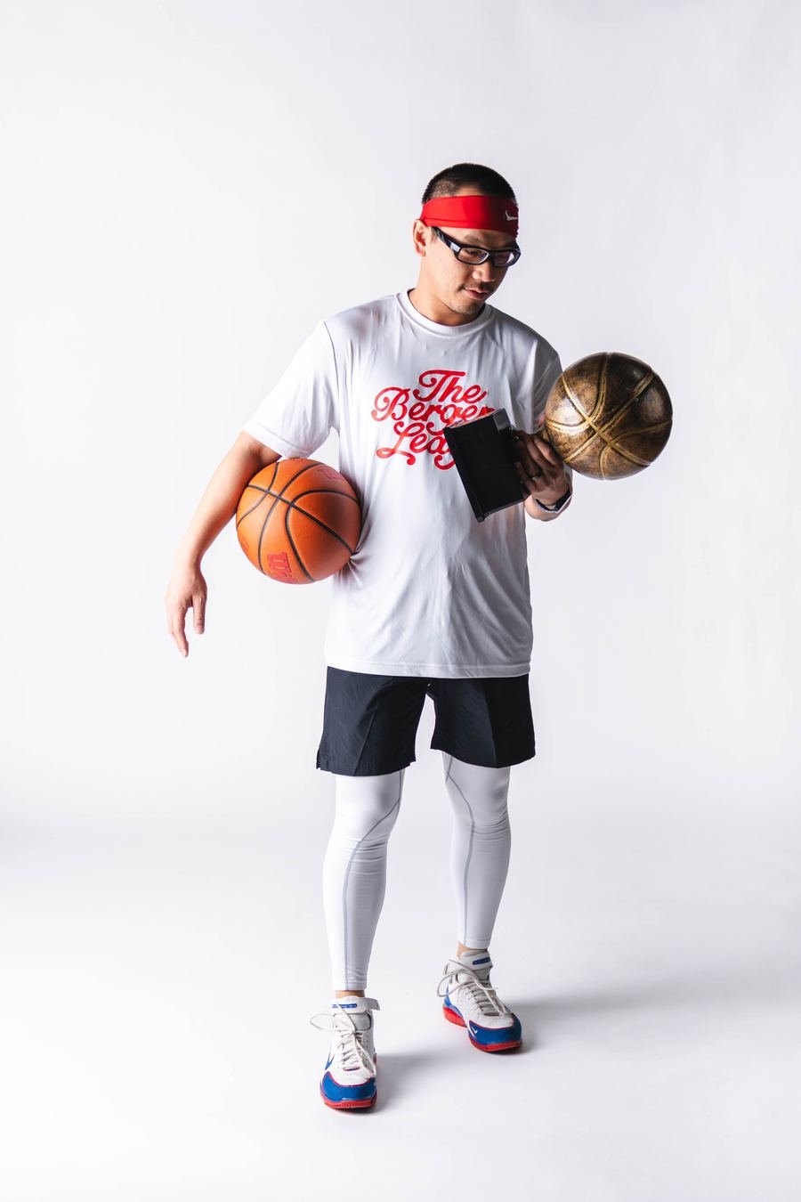 Player balancing the trophy and a basketball