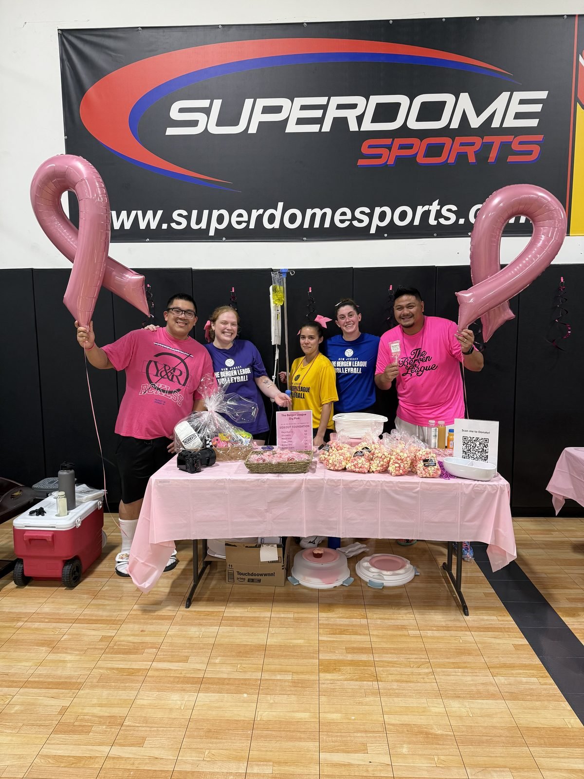 Superdome Sports banner at the pink-out fundraiser night